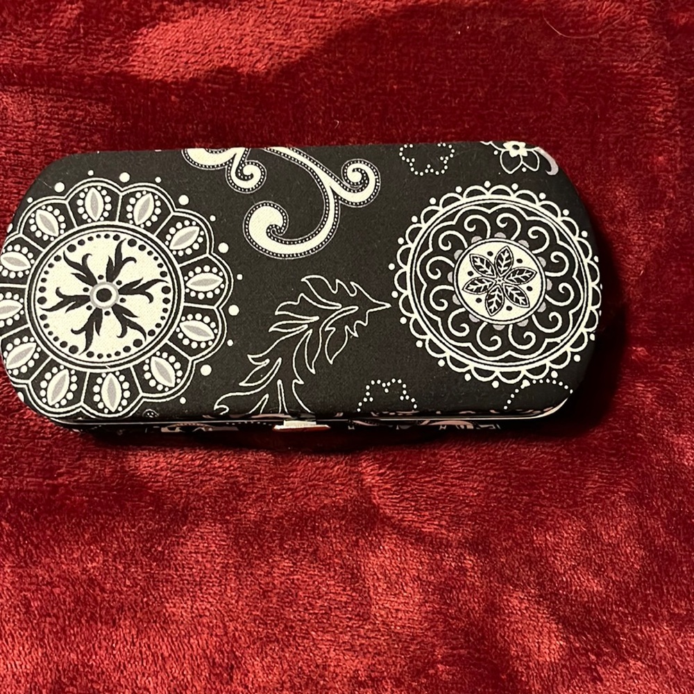 31 hardback wallet black and white measures 7 1/2 by 3 1/2 great condition